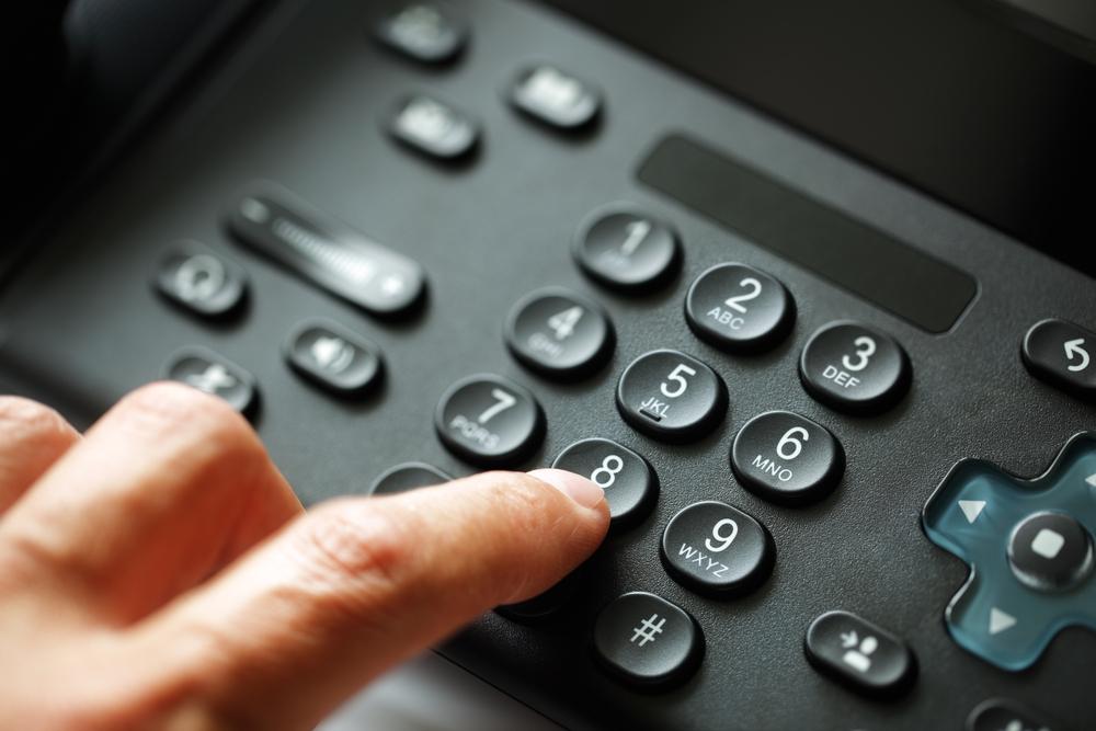 Many businesses are realizing the benefits of VoIP. Dialing VoIP telephone keypad